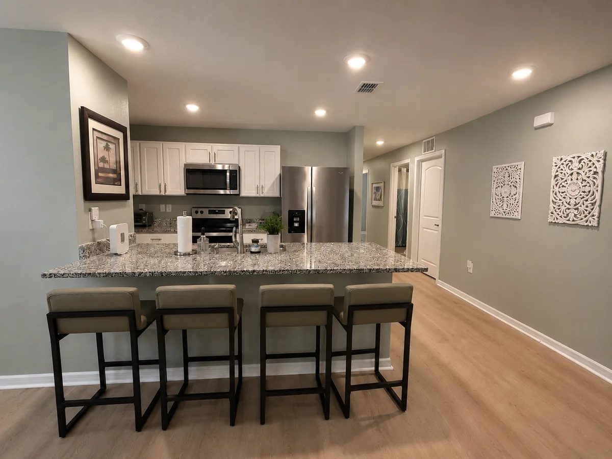 Kitchen with granite breakfast bar and stainless appliances