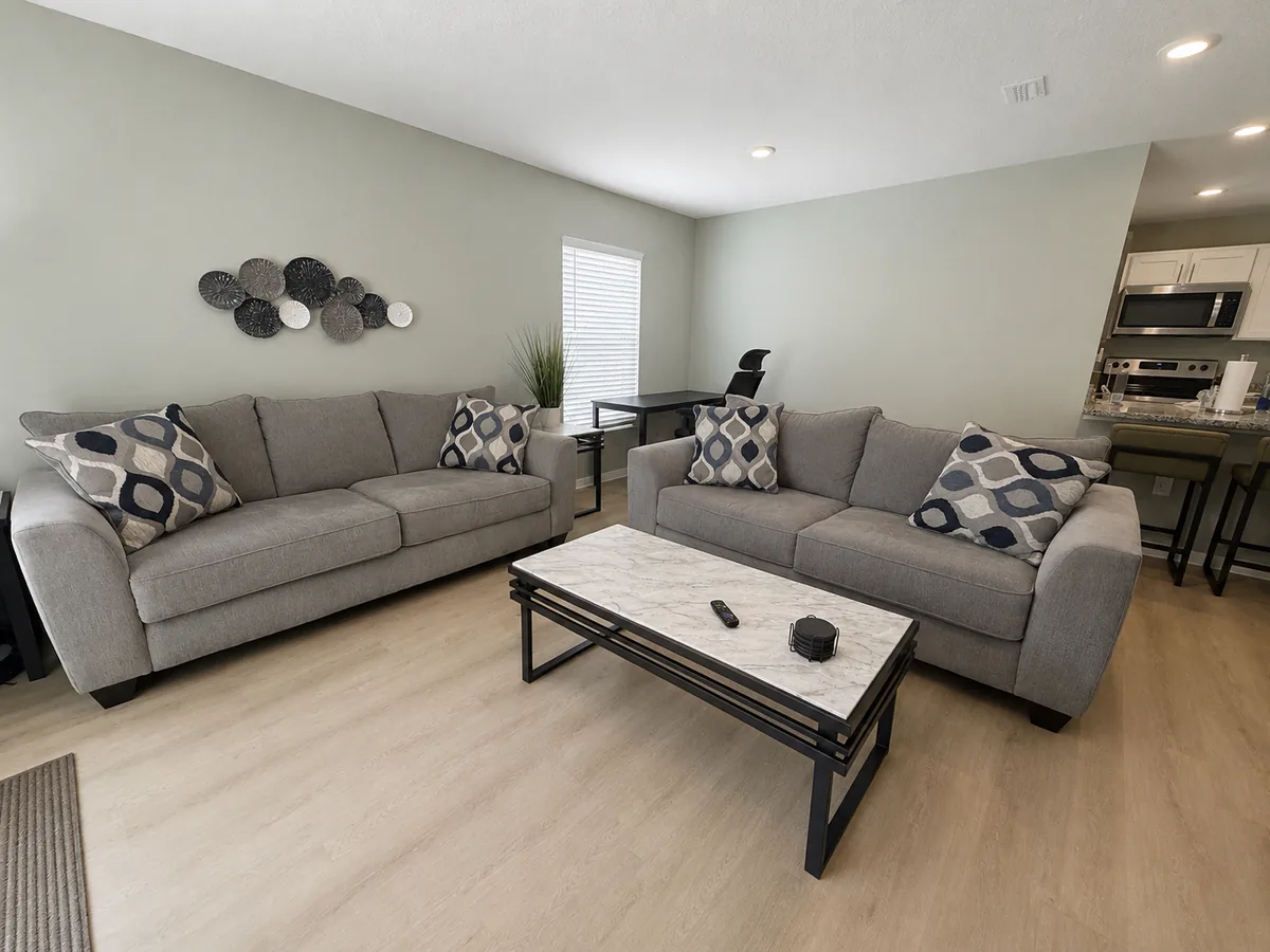 Open-plan living room with two sofas and a coffee table