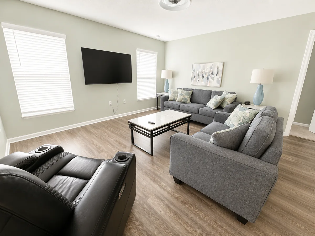 Living room with recliners and a wall-mounted television